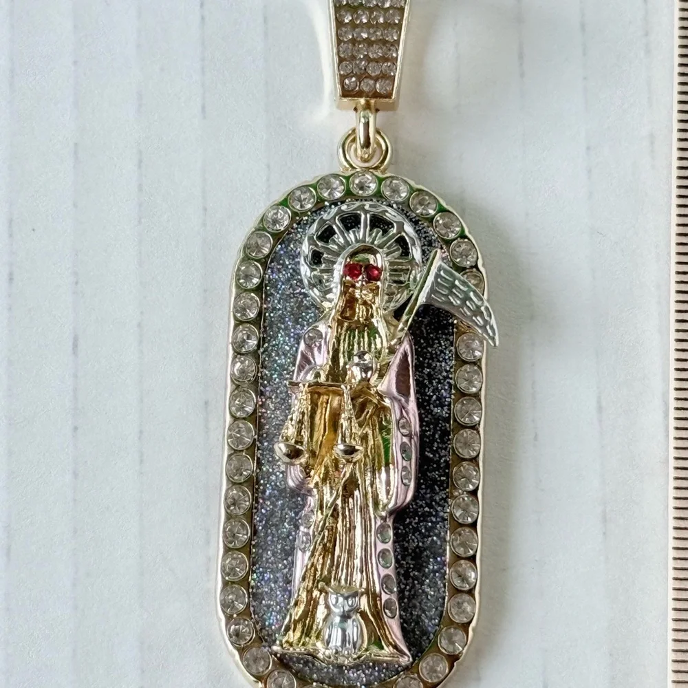 Chain‎ 24”of man with holy death medal. Laminated gold New